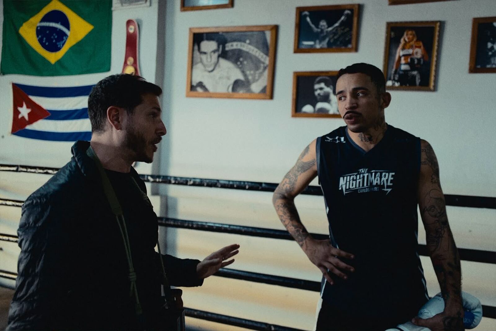 Nik Fonseca directing Carlos Prates by the ring between takes