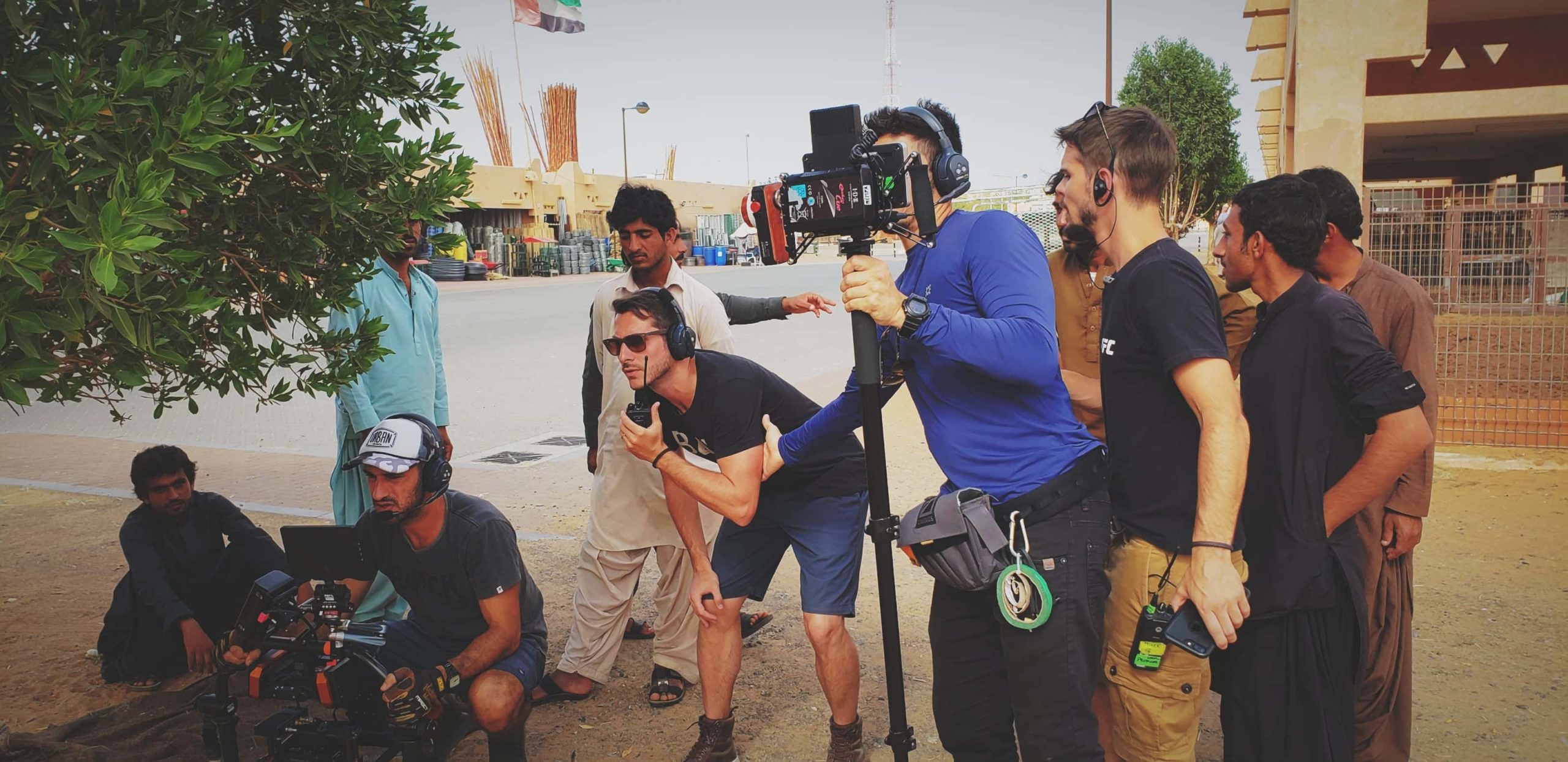 documentary film crew with locals in Al Ain's camel market